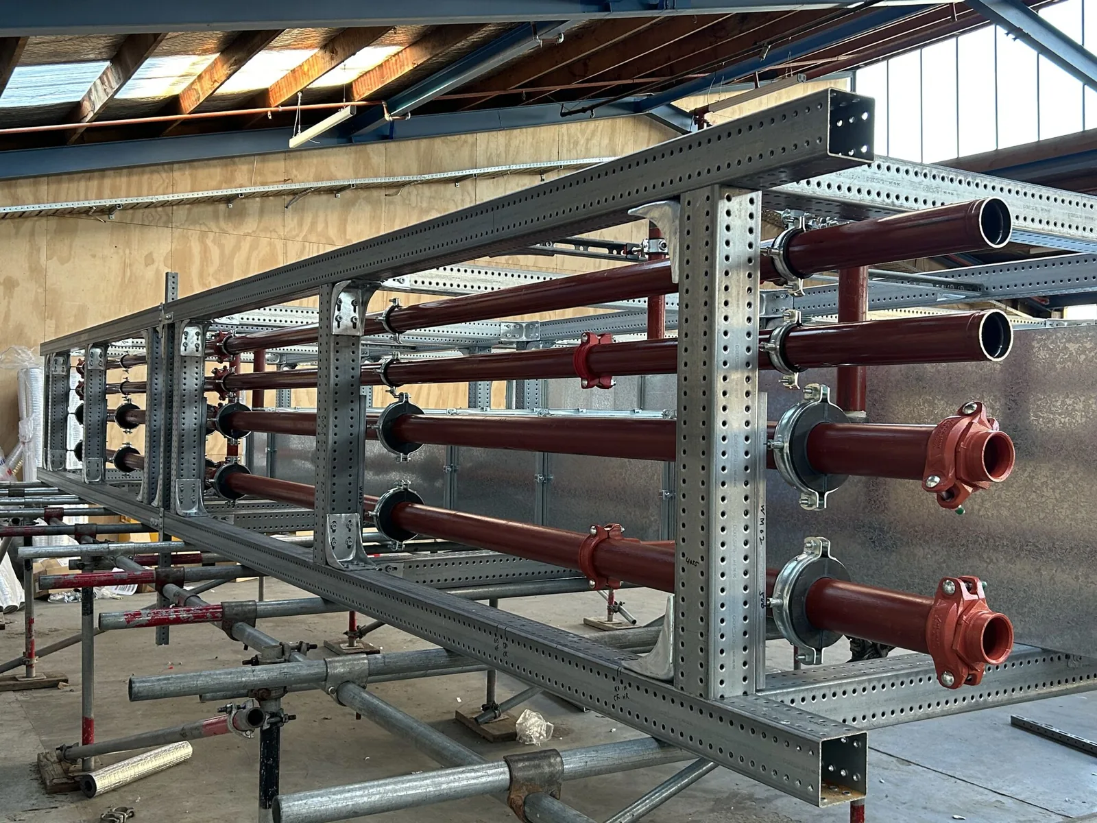 Parallel pipework installed in a galvanised modular steel support frame